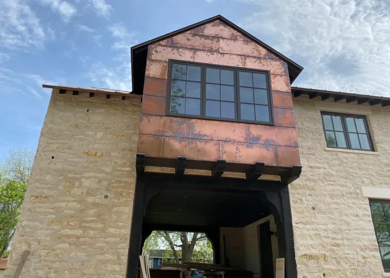 Copper metal panel facade on a stone building for Skylight Installation in Mount Arlington